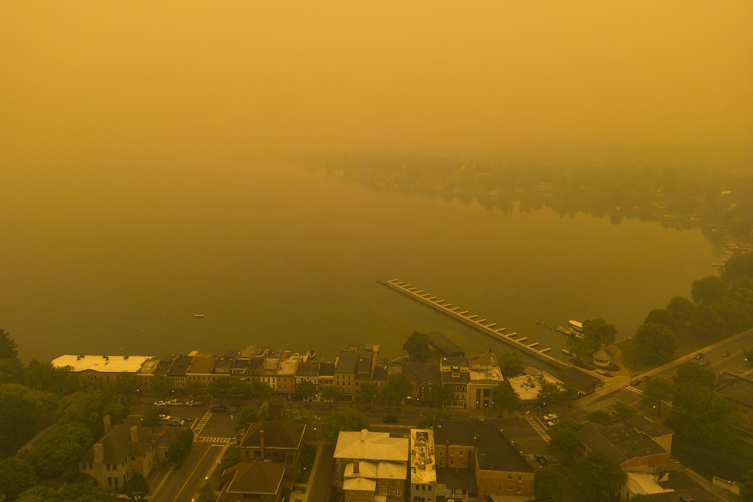 Air pollution from wildfires in Canada cover New York with an orange haze.